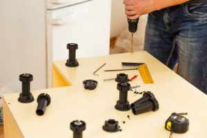 Furniture manufacturing inside working with the drill